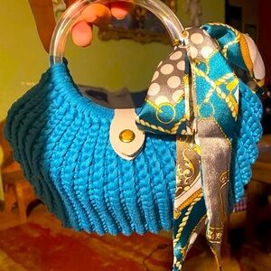 Hand crocheted shell purse. Small clear stylish handles and satin scarf.